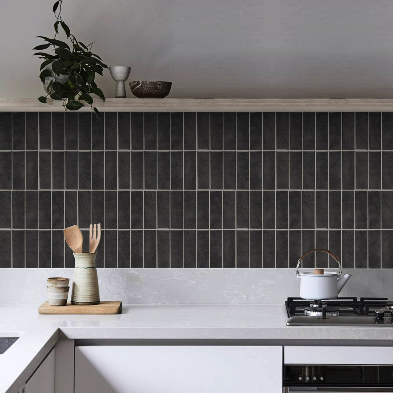 dark grey and black peel and stick tiles in kitchen in a stacked subway design