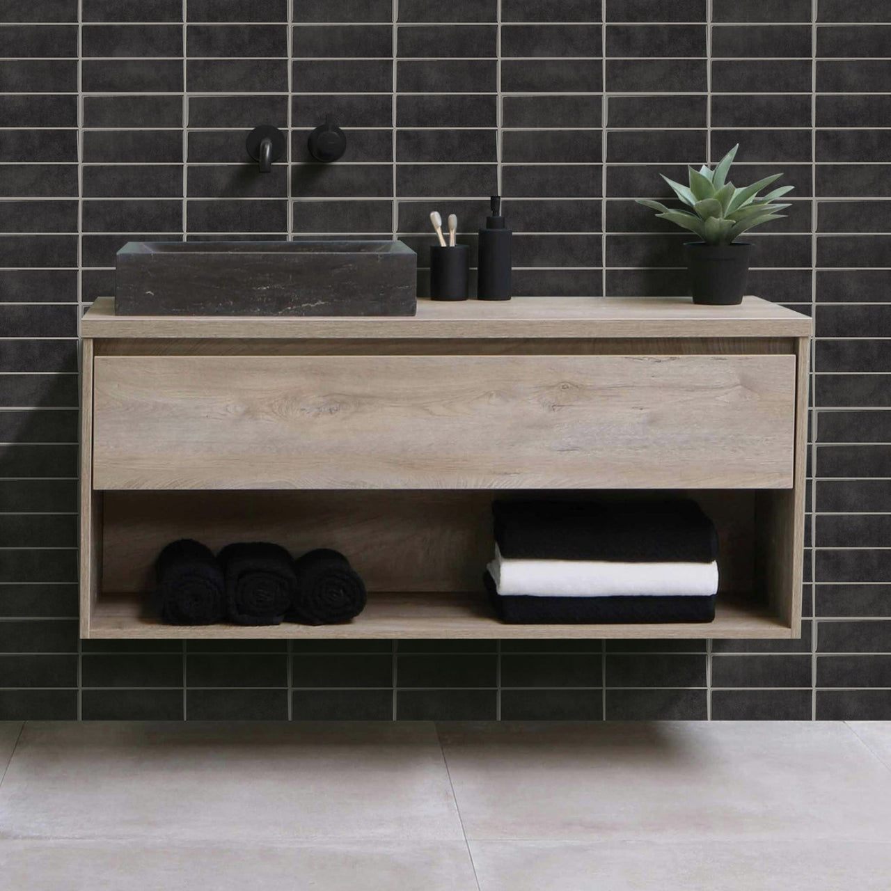 dark grey stacked subway tiles on bathroom wall