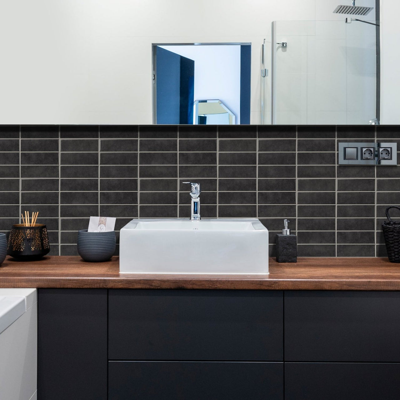 bathroom with grey stacked subway tiles