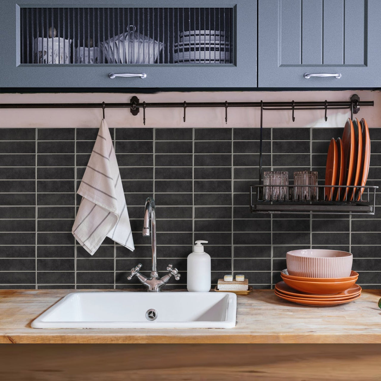 Dark grey stacked subway tiles in kitchenette 