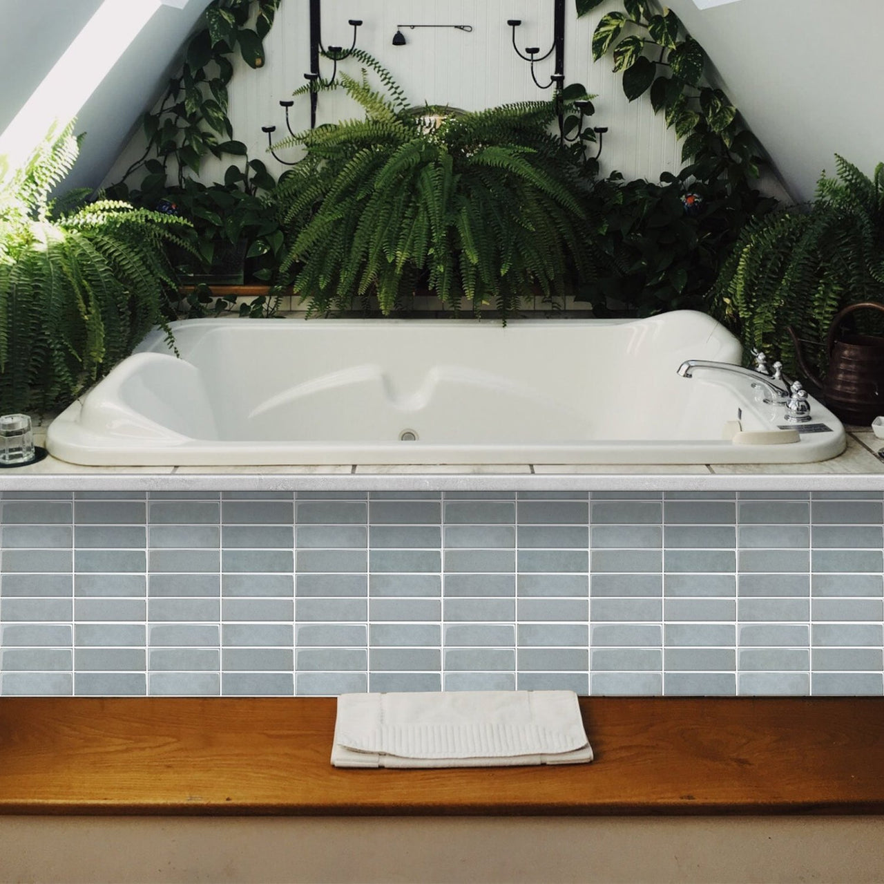 Blue stacked subway tiles on bath