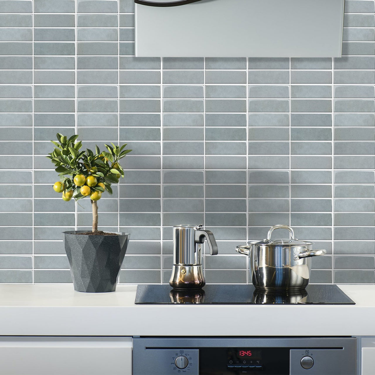 kitchen cooking area with blue stacked subway tiles