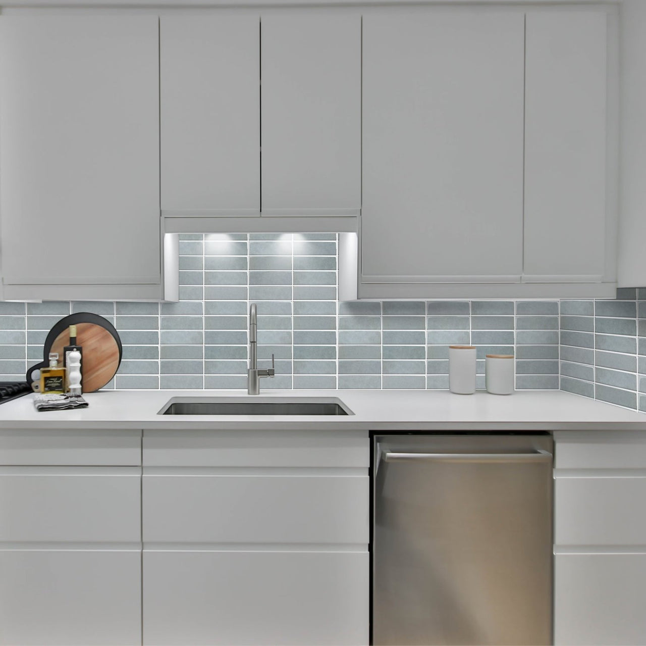 White kitchen with blue stacked subway tiles