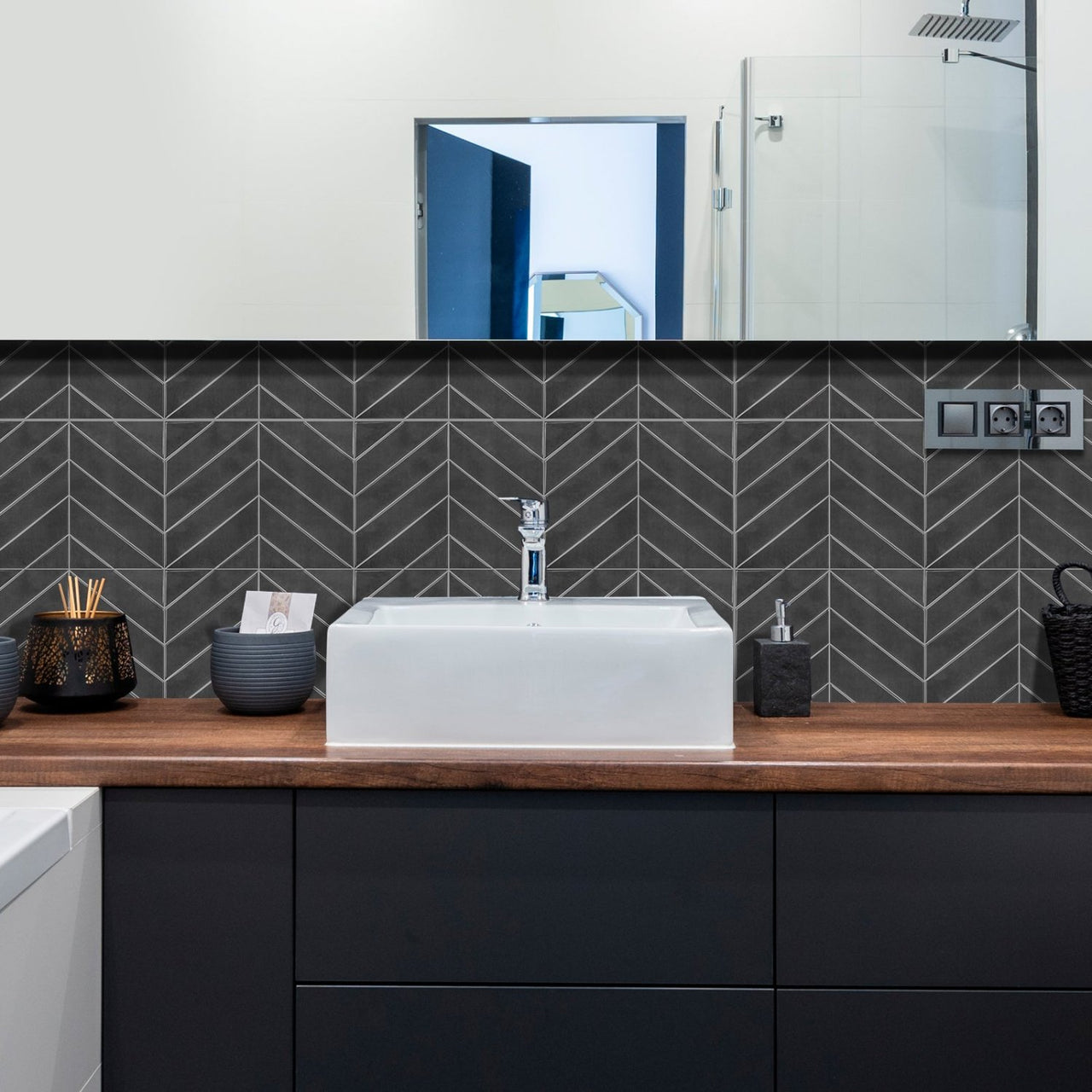 charcoal chevron tiles in black bathroom