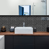 Thumbnail for charcoal chevron tiles in black bathroom