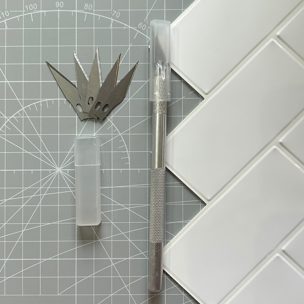Craft knife for cutting peel and stick wall tiles