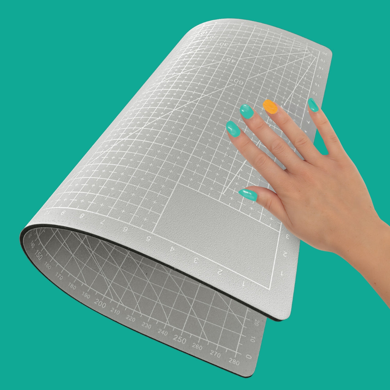 grey self-healing cutting mat that is reversible with grids