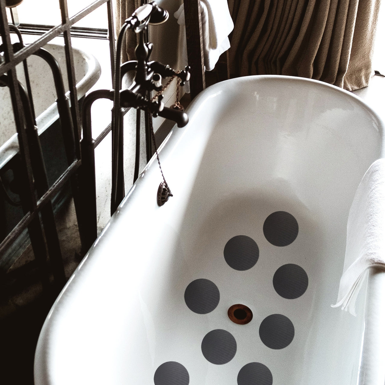 Grey anti slip grip dots in bath tub