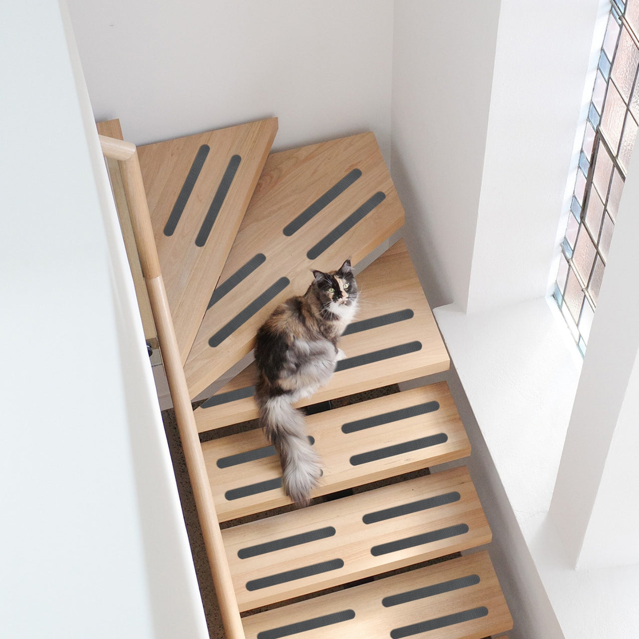 Grey self-adhesive anti slip strips applied in stairs