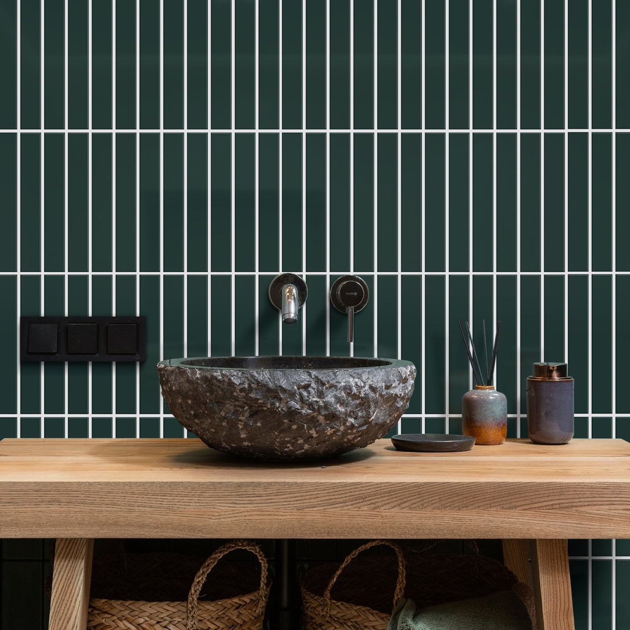 Dark green kit kat tiles behind bathroom vanity