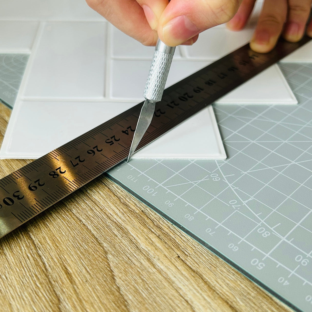 Craft knife used with metal ruler