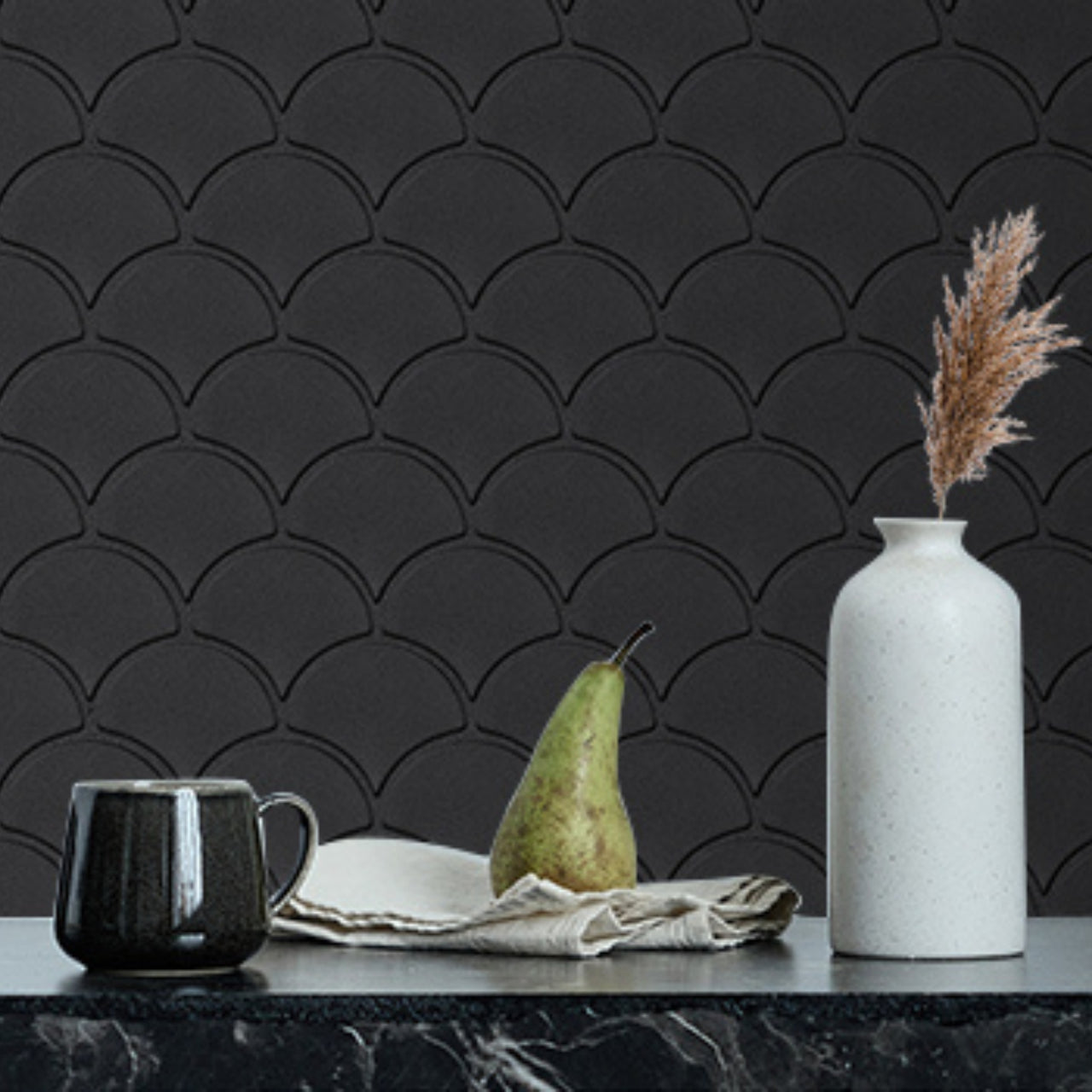 Oriental fan tiles in black with black grout as a kitchen backsplash