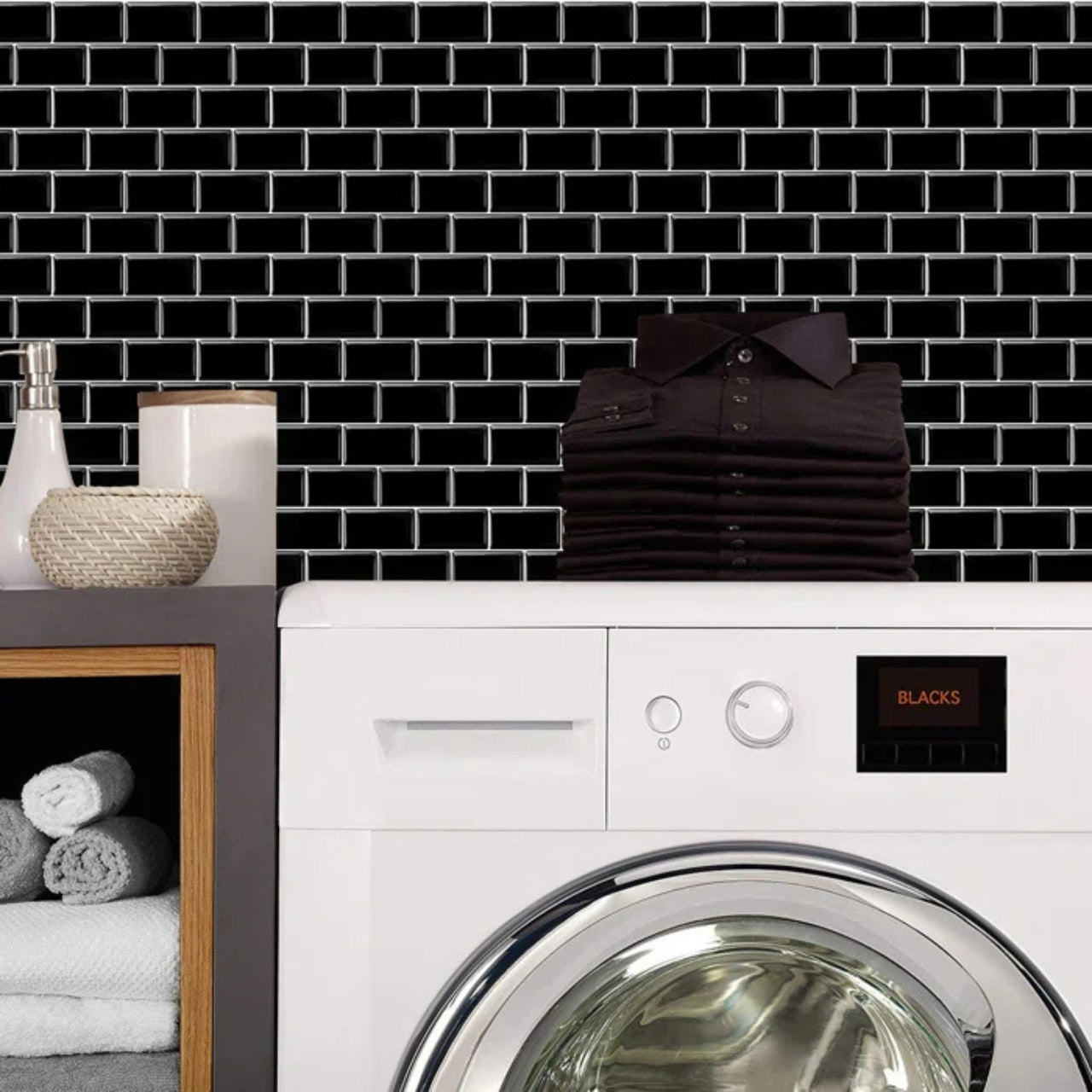 Black subway peel and stick vinyl wall tiles with white grout in laundry room
