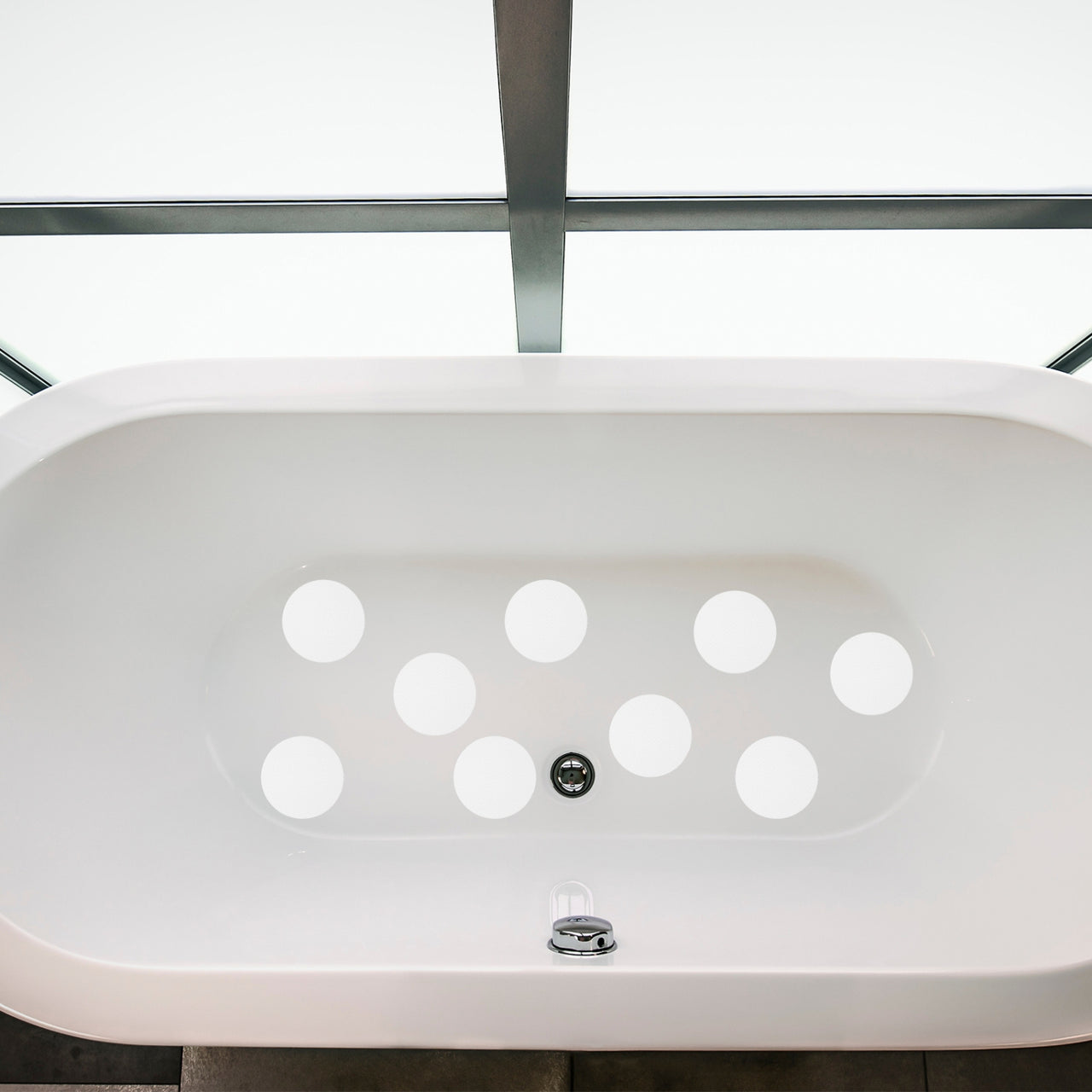 White anti slip grip sticker dots in a bath tub