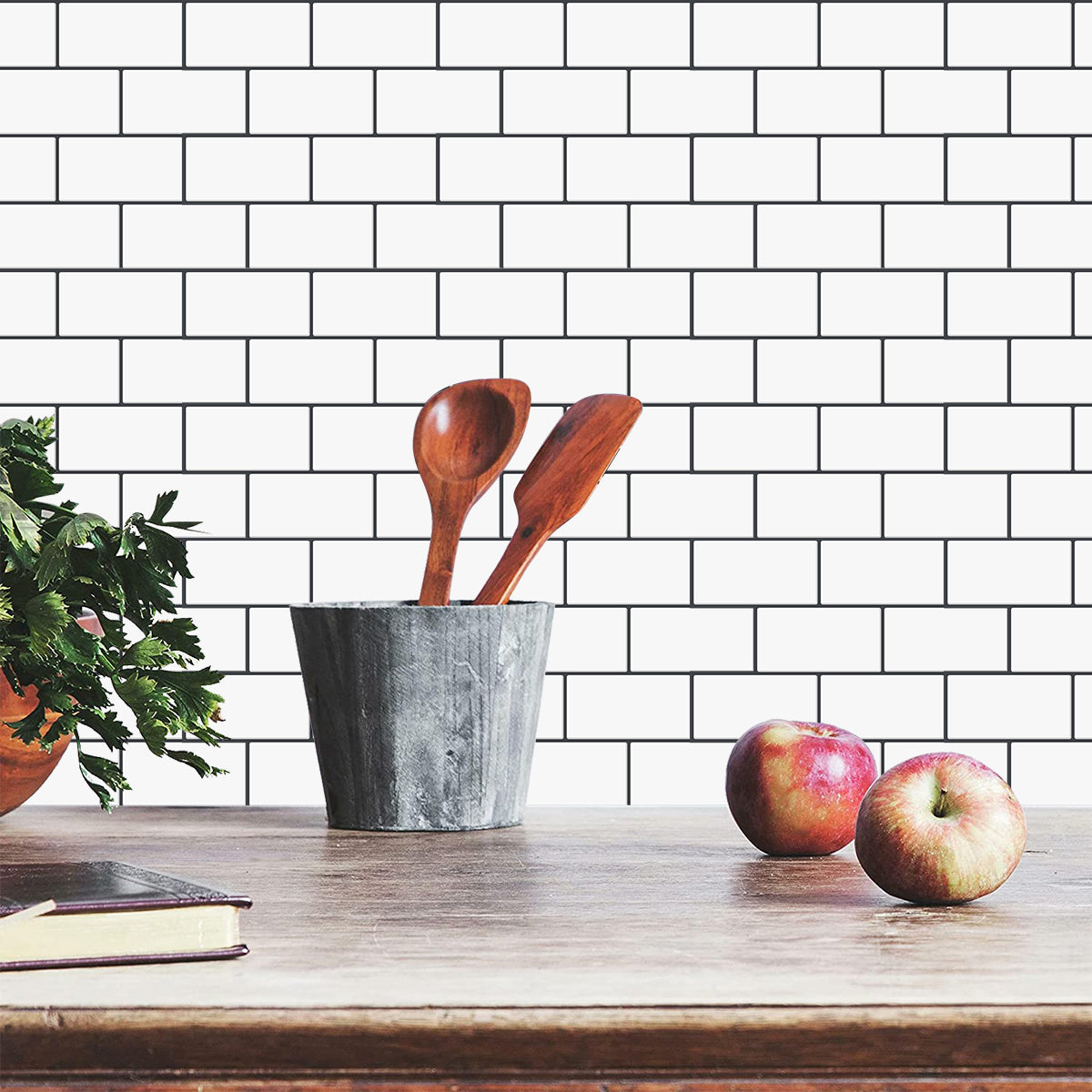 White subway tiles with black grout as a splash back