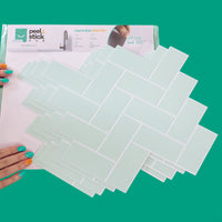 Thumbnail for Packaging of mint green herringbone tiles