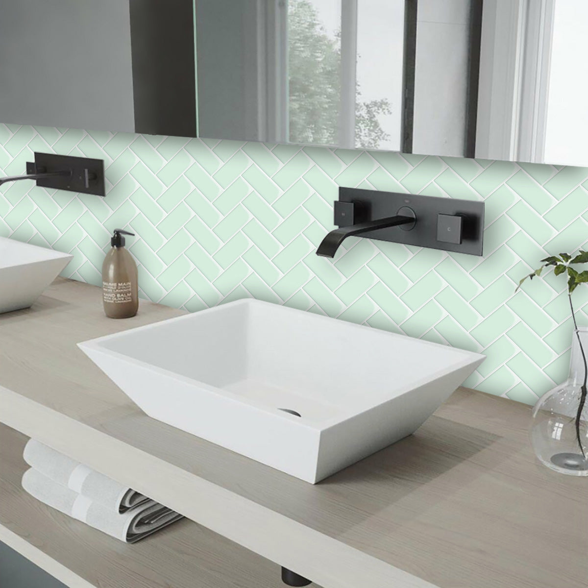 Mint green herringbone tiles over bathroom vanity