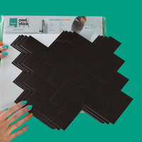 Thumbnail for Packaging of black herringbone tiles