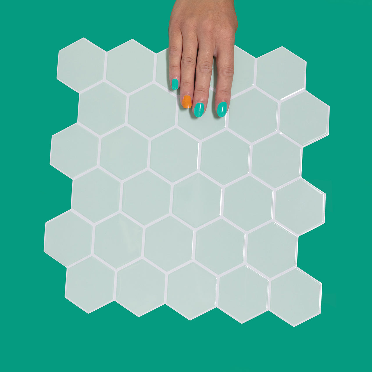 Mint green hexagon tile with white grout