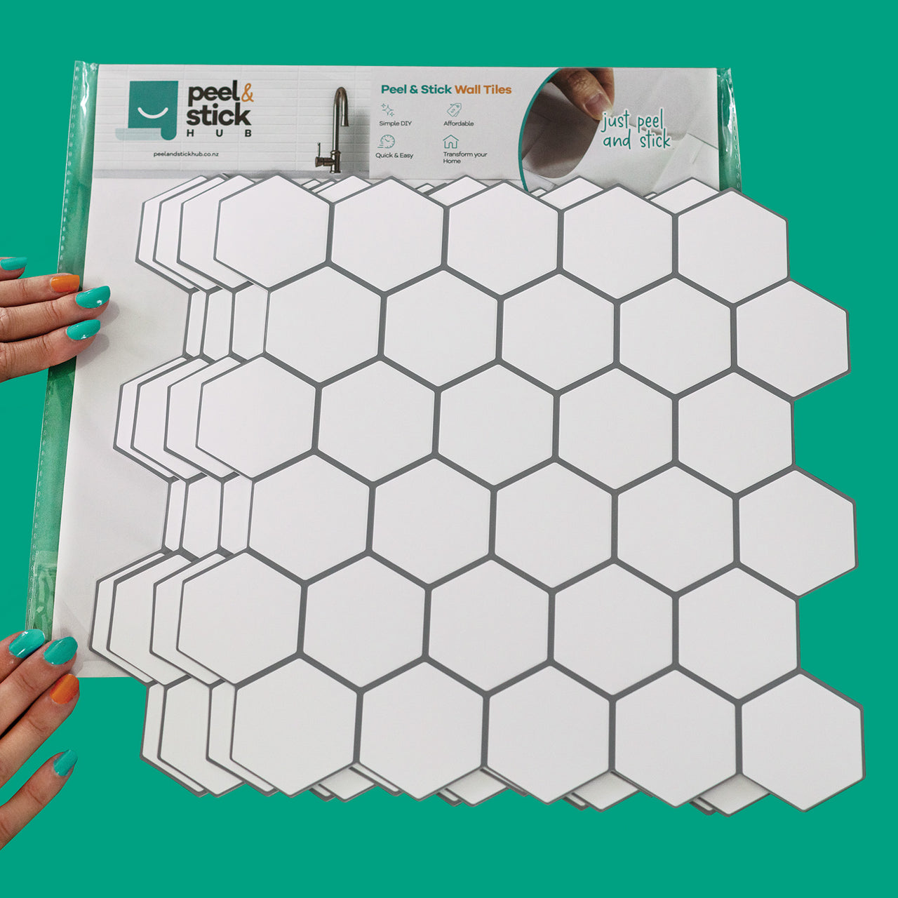 4 white hexagon peel and stick tiles per package