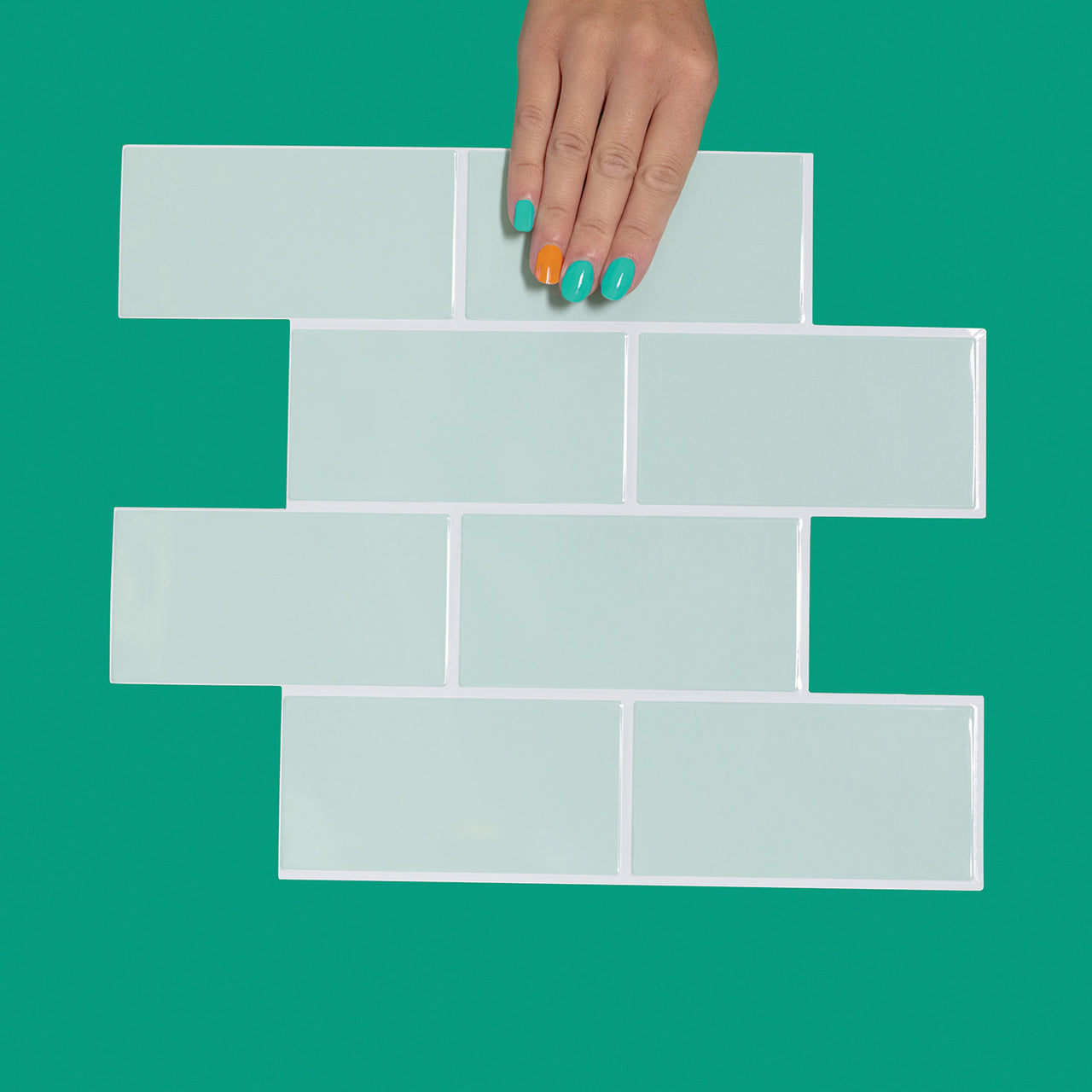 Mint green subway tile with white grout