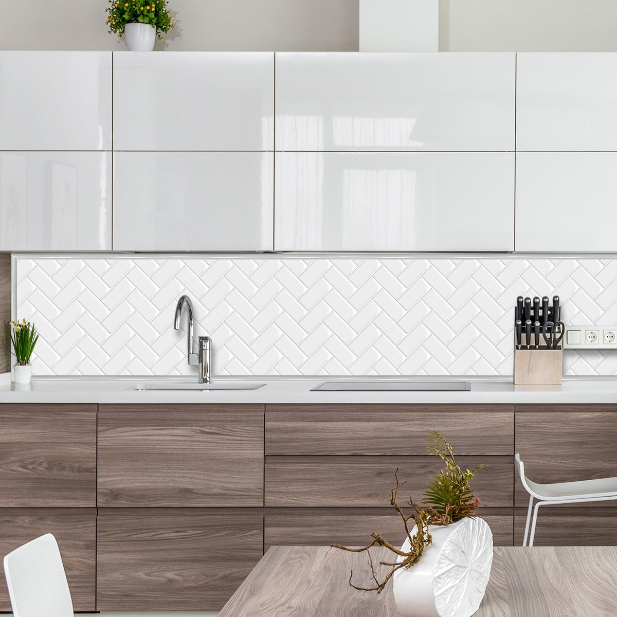 Grey edge trim around white kitchen tile splash back