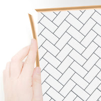 Thumbnail for Rose gold edge trim around herringbone white tiles
