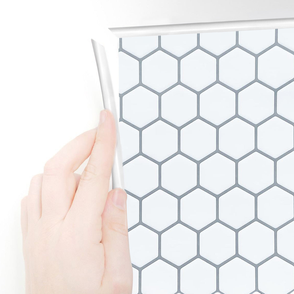 White edge trim applied around white hexagon tiles