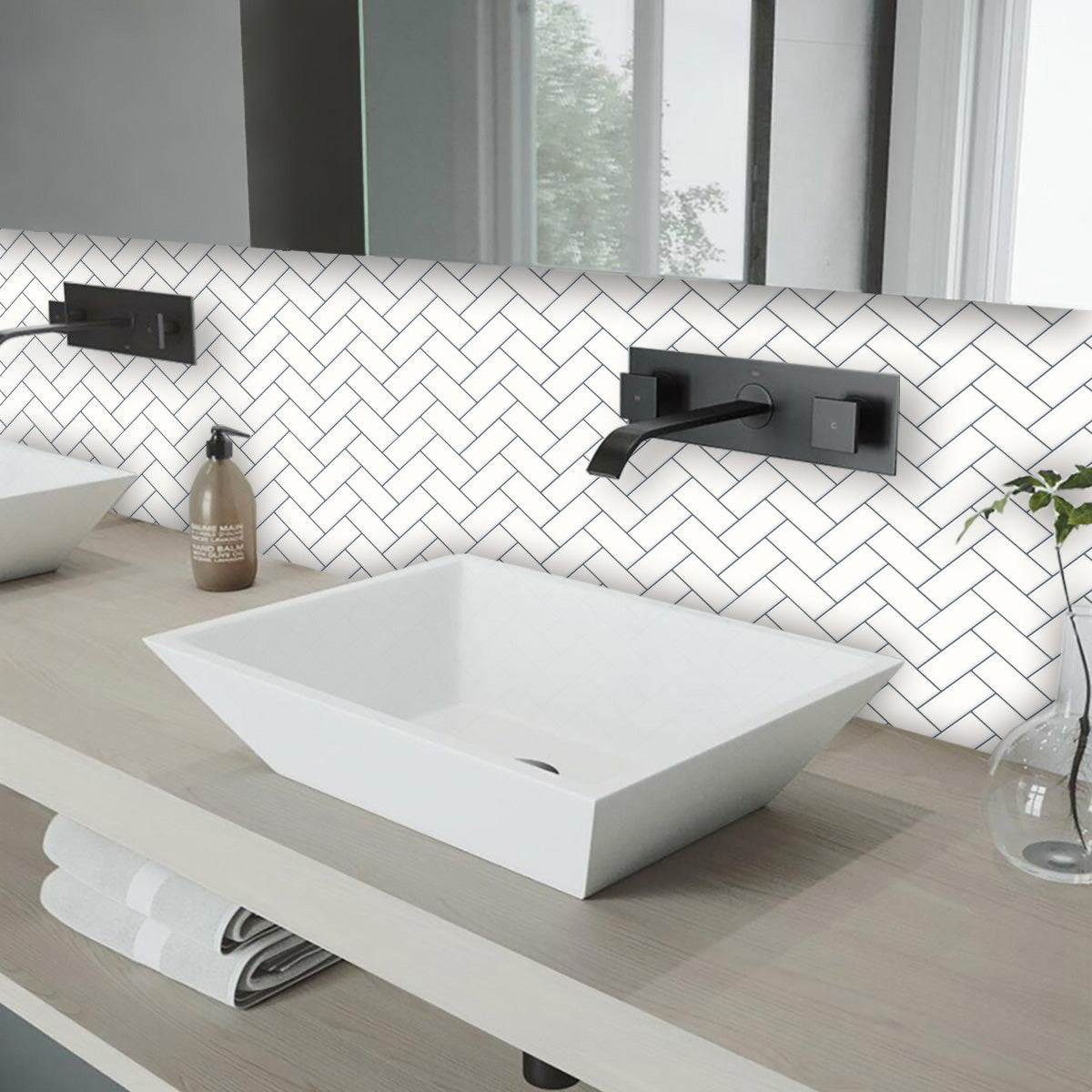 White herringbone tiles above a bathroom vanity
