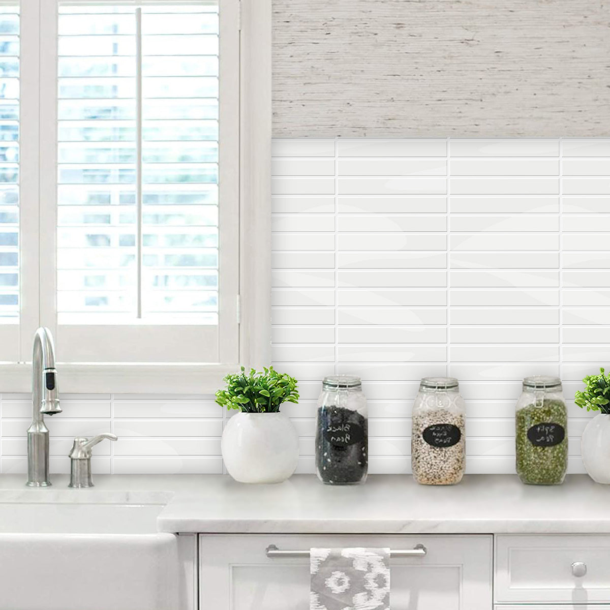 White peel and stick kit kat tiles with white grout in kitchen